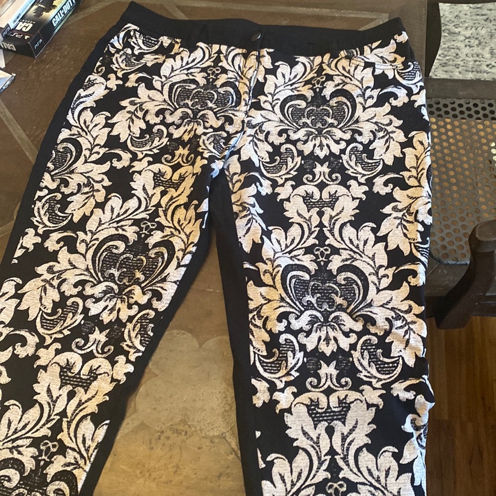 Cute cropped pants with fun black/white print on front and all black in back.